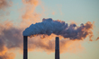 Pollution and steam rise from the stacks of the Miami Fort Power Station, which is situate...