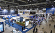 Domestic and foreign military officials and visitors enter the exhibition hall during the...