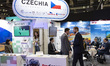 Military officials and visitors from various countries tour the Czechia booth during the S...