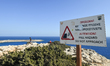 AYIA NAPA, CYPRUS – OCTOBER 19: A 'Fall Hazard – Do Not Approach' warning sign is seen at...