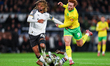 Dion Sanderson of Derby County is in defensive action as Ebou Adams of Derby County hits t...