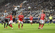 Dan Burn of Newcastle United heads on goal during the UCL League Stage match between Newca...