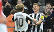 Harvey Barnes of Newcastle United celebrates with teammate Anthony Gordon after scoring hi...
