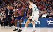 Myles Cale of FC Barcelona is in action with Deividas Sirvydis of Zalgiris Kaunas during t...
