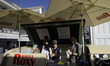 Red Bull driver Yuki Tsunoda participates in activation and ice cream preparation prior to...