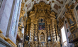 A decorative golden altar inside the Church of Sao Francisco . The richly carved Baroque w...
