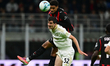 Koni De Winter of AC Milan and Stefano Moreo of Pisa SC battle for the ball during the Ser...