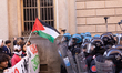 In Turin, Italy, on October 25, 2025, pro-PAL protesters clash with police, who charge at...