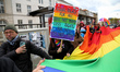 Participants wave a huge rainbow flag in the 17th Christopher Street Day (CSD) parade in C...