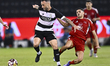 Guilherme Torres of Al Sadd SC and Wassem Keddari of Al Arabi SC are in action during the...