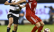 Hasan Khalid Alhaydos of Al Sadd SC and Abdulla Hassan Al-Marafi of Al Arabi SC are in act...