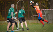 Players from the Lodz SkyWeavers (in orange) compete against the Krakow Dragons (green) du...