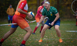 Players from the Lodz SkyWeavers (in orange) compete against the Krakow Dragons (green) du...