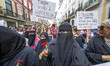Several women wearing burkas march during a demonstration in Rossio Square in Lisbon, Port...