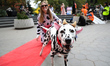 A woman dressed like her dalmatian poses for a photo during the Washington Square Park Hal...
