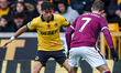Hugo Bueno of Wolverhampton Wanderers and Jacob Bruun Larsen of Burnley FC are in action d...