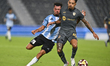 Zouhzouh El Amine of Al-Wakrah SC and Gregore De Magalhaes Favero of Al Rayyan SC are in a...