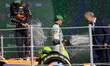 McLaren driver Lando Norris (white uniform) takes first place in the Mexican Grand Prix at...