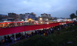 Nepali Hindu devotees perform rituals at Gaurighat riverbank in Kathmandu, Nepal, on Octob...