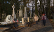 People visit the Old Powazki Cemetery in Warsaw, Poland, on October 25, 2025. 