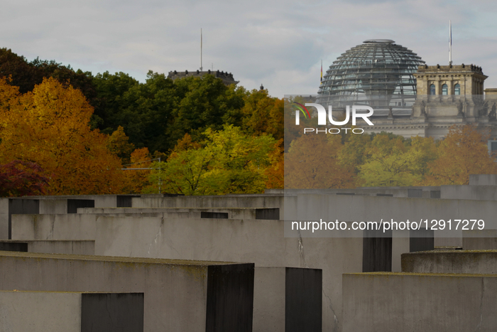 Reichstag With Dome Above Holocaust Memorial In Autumn Foliage