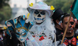 A woman takes part in the Mega Procession of Catrinas parade as part of Dia de Muertos cel...