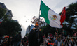 A person participates in the Mega Procession of Catrinas parade as part of Dia de Muertos...