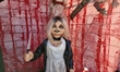 Halloween decorations and other scary creatures cover the exterior of a Dyker Heights home...