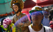 A devotee attends the Church of San Hipolito to bless the images of Saint Jude and give th...