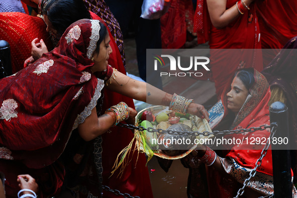 Hindu women devotees worship the Sun god at the Shrine Galta Ji Temple 'Kund' during the 'Chhath Puja' festival in Jaipur, Rajasthan, India,... by Vishal Bhatnagar/NurPhoto