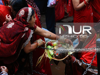 Hindu women devotees worship the Sun god at the Shrine Galta Ji Temple 'Kund' during the 'Chhath Puja' festival in Jaipur, Rajasthan, India,... by Vishal Bhatnagar/NurPhoto