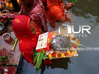 A Hindu woman devotee worships the Sun god at the Shrine Galta Ji Temple 'Kund' during the 'Chhath Puja' festival in Jaipur, Rajasthan, Indi... by Vishal Bhatnagar/NurPhoto