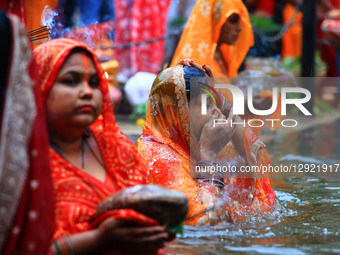 Hindu women devotees worship the Sun god at the Shrine Galta Ji Temple 'Kund' during the 'Chhath Puja' festival in Jaipur, Rajasthan, India,... by Vishal Bhatnagar/NurPhoto