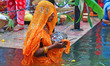 A Hindu woman devotee worships the Sun god at the Shrine Galta Ji Temple 'Kund' during the...