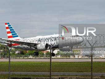 An American Airlines airplane approaches Miami International Airport for landing in Miami, Florida.  by Ronen Tivony/NurPhoto