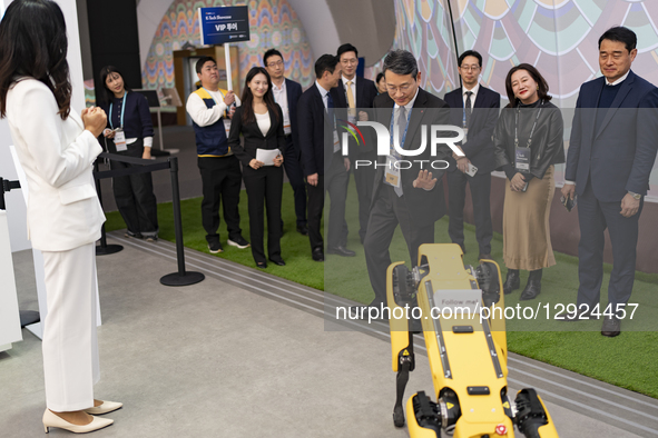 Cho Joo-wan, CEO of LG Electronics, greets Spot, a robot dog displayed at Hyundai Motor's booth, while touring the K-Tech Showcase, a side e... by Chris Jung/NurPhoto