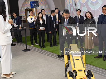 Cho Joo-wan, CEO of LG Electronics, greets Spot, a robot dog displayed at Hyundai Motor's booth, while touring the K-Tech Showcase, a side e... by Chris Jung/NurPhoto