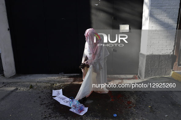 A mannequin covered in red paint simulating blood is seen during a protest outside the Indie Rocks Forum in Mexico City, Mexico, on October... by Gerardo Vieyra/NurPhoto