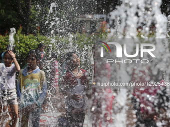Children play at a public park fountain during hot weather in Jakarta, Indonesia, on October 19, 2025. Indonesia's Meteorology, Climatology,... by Agoes Rudianto/NurPhoto