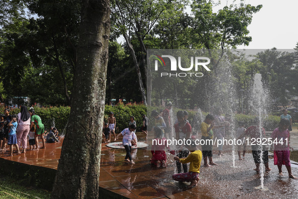 Children play at a public park fountain during hot weather in Jakarta, Indonesia, on October 19, 2025. Indonesia's Meteorology, Climatology,... by Agoes Rudianto/NurPhoto