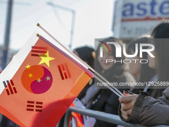 Chinese supporters hold China and South Korea flags near Gimhae International Airport in Gimhae, South Korea, on October 30, 2025, on the da... by Seung-il Ryu/NurPhoto