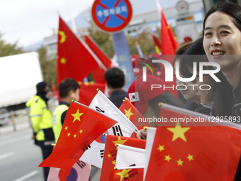 Chinese supporters hold China and South Korea flags near Gimhae International Airport in Gimhae, South Korea, on October 30, 2025, on the da... by Seung-il Ryu/NurPhoto
