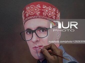 An artisan gives final touches to a portrait painting of Omar Abdullah, Chief Minister of India's Jammu and Kashmir region, during the 'Know... by Firdous Nazir/NurPhoto