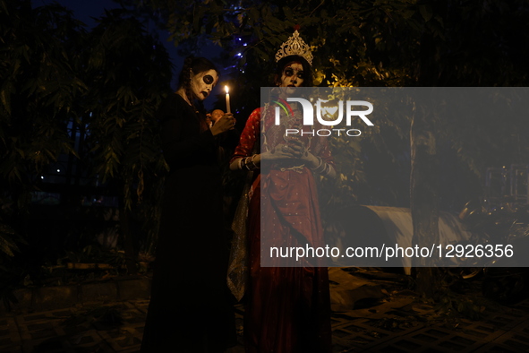 A woman dressed as a ghost in a costume poses for a picture during celebrations ahead of Halloween in Kolkata, India, on October 30, 2025.  by Rupak De Chowdhuri/NurPhoto