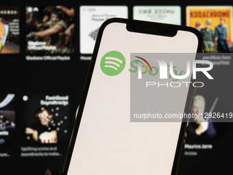 Close-up images show the Spotify logo and mobile application interface on a smartphone screen. The photos illustrate the popular music strea... by Matteo Della Torre/NurPhoto