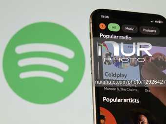 Close-up images show the Spotify logo and mobile application interface on a smartphone screen. The photos illustrate the popular music strea... by Matteo Della Torre/NurPhoto