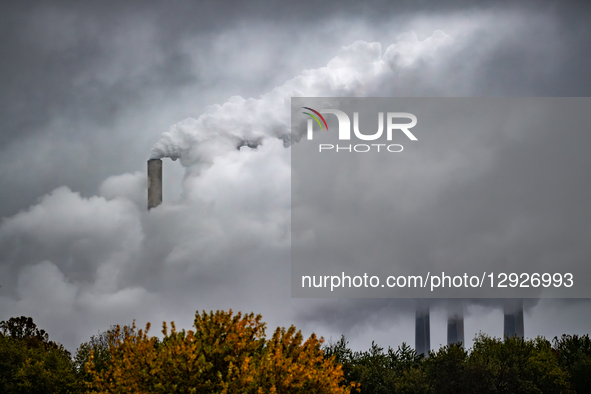 Pollution and steam rise from the stacks of the Miami Fort Power Station, which is situated along the Ohio River near Cincinnati, Ohio, on O... by Jason Whitman/NurPhoto