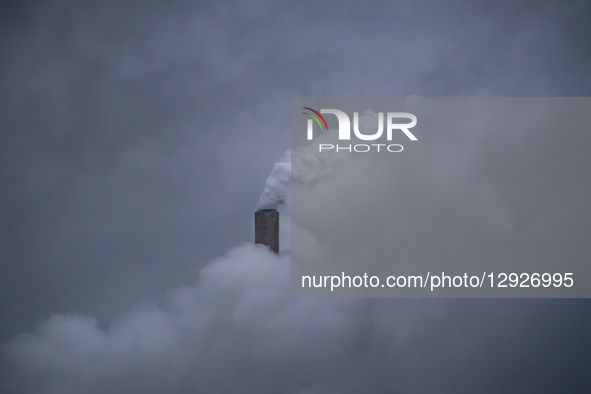Pollution and steam rise from the stacks of the Miami Fort Power Station, which is situated along the Ohio River near Cincinnati, Ohio, on O... by Jason Whitman/NurPhoto