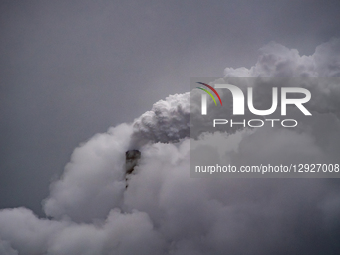 Pollution and steam rise from the stacks of the Miami Fort Power Station, which is situated along the Ohio River near Cincinnati, Ohio, on O... by Jason Whitman/NurPhoto