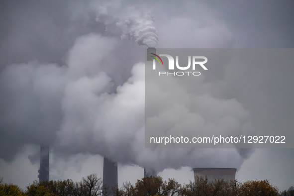Pollution and steam rise from the stacks of the Miami Fort Power Station, which is situated along the Ohio River near Cincinnati, Ohio, on O... by Jason Whitman/NurPhoto